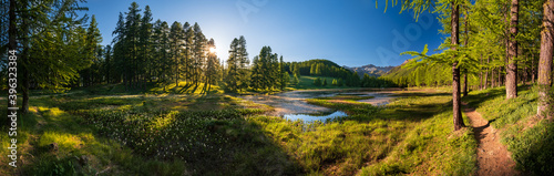 Sunset in the Queyras Nature Park with Lac de Roue lake late Spring -early Summer (panoramic). Arvieux, Hautes-Alpes, French Alps, France