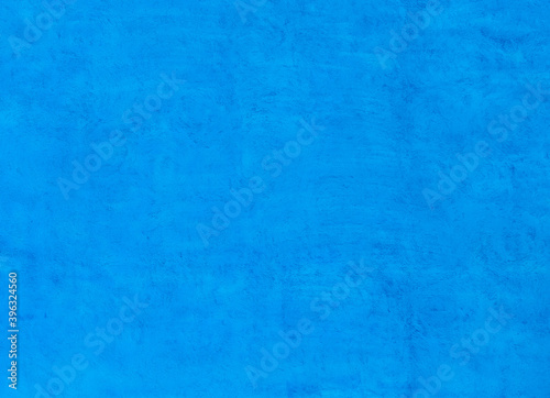Bright blue concrete wall texture background.