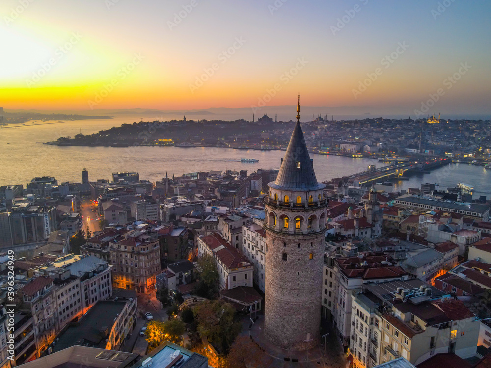 Fototapeta premium Aerial Galata Tower at Sunset. Galata Bridge and Golden Horn of Istanbul with beautiful colors at Sunset. 