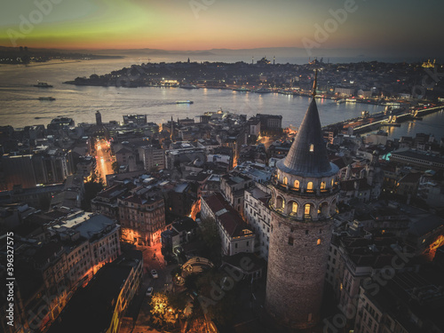 Aerial Galata Tower at Sunset. 
Galata Bridge and Golden Horn of Istanbul with beautiful colors at Sunset. 