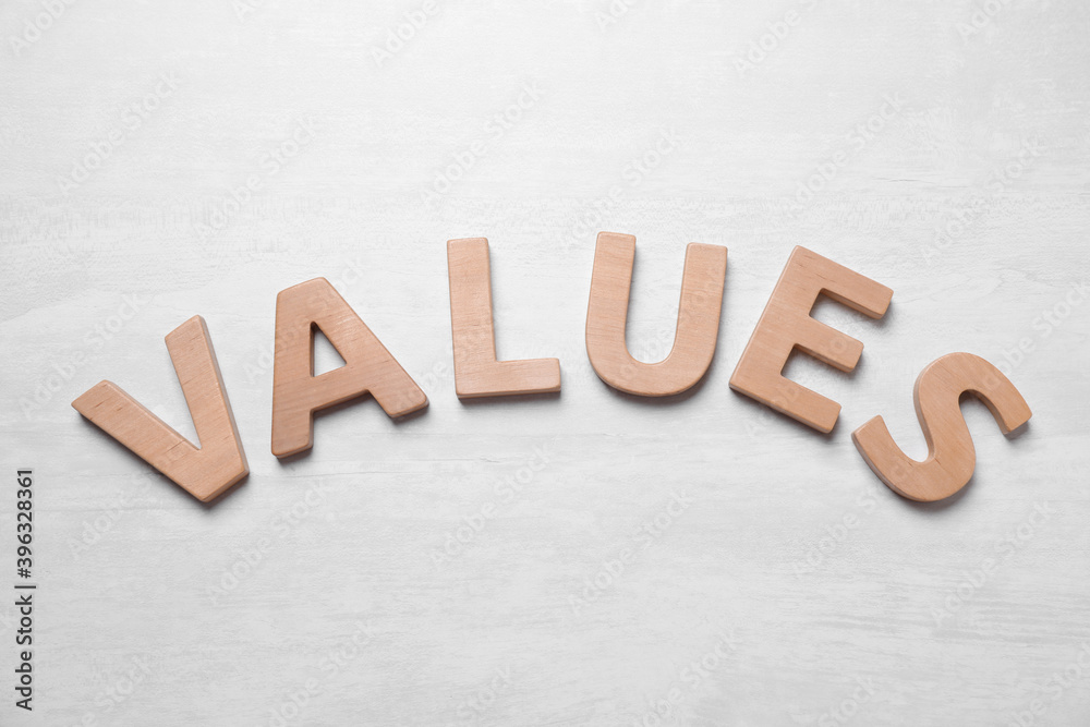 Word VALUES made of wooden letters on white background, flat lay Word VALUES made of wooden letters on white background, flat lay