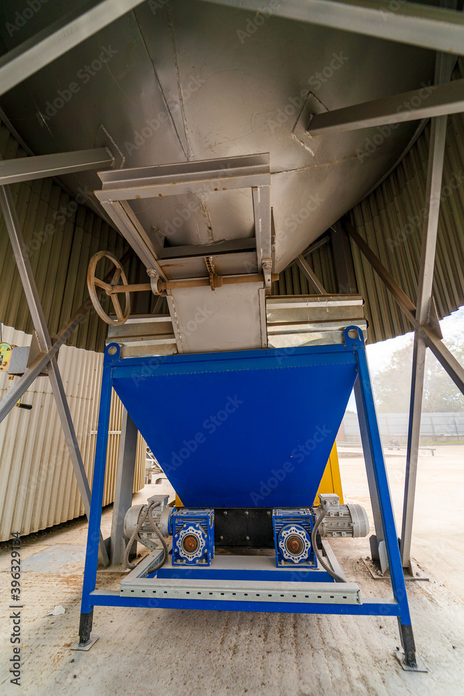 Grain storage in large slots. Silo with grain. Grain storage tank view from below. Grain storage in large slots. Silo with grain. Grain storage tank view from below.