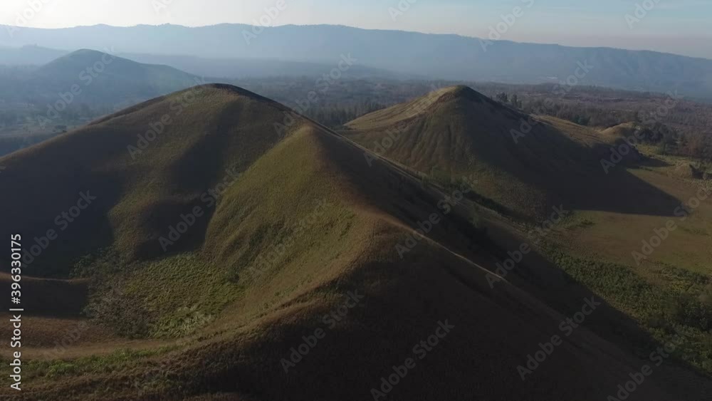 Beautiful Kawah Wurung hill and mountain view with green field Beautiful Kawah Wurung hill and mountain view with green field