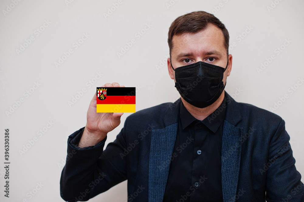 Foto de German man wear black formal and protect face mask, hold