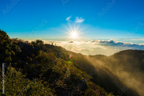 Morning sunrise with fog on top of mountain blue sky vacation trekking winter photo