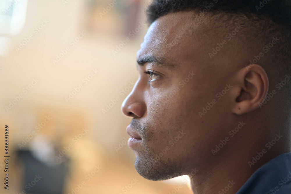 Profile view of african-american guy with serious look Profile view of african-american guy with serious look