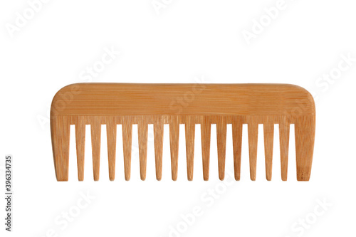 wooden comb isolated on white background with clipping path and copy space for your text photo