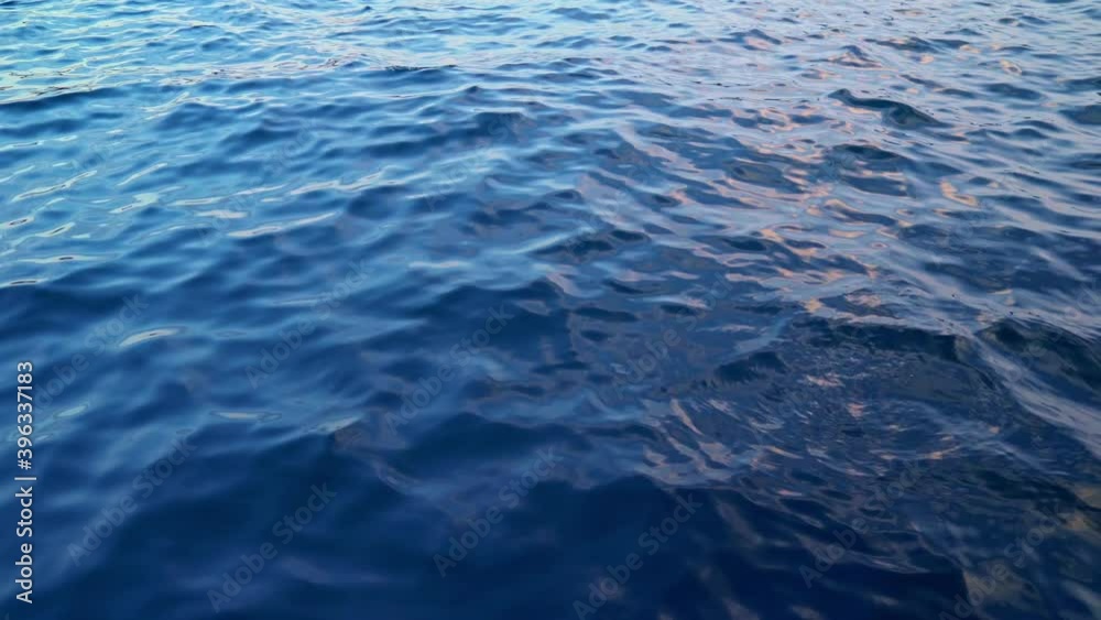 Beautiful sunset on the seaside. Amazing colors of the evening sky reflecting in the river. Small wawes in the water. Beautiful color of the sky . Beautiful sunset on the seaside. Amazing colors of the evening sky reflecting in the river. Small wawes in the water. Beautiful color of the sky .