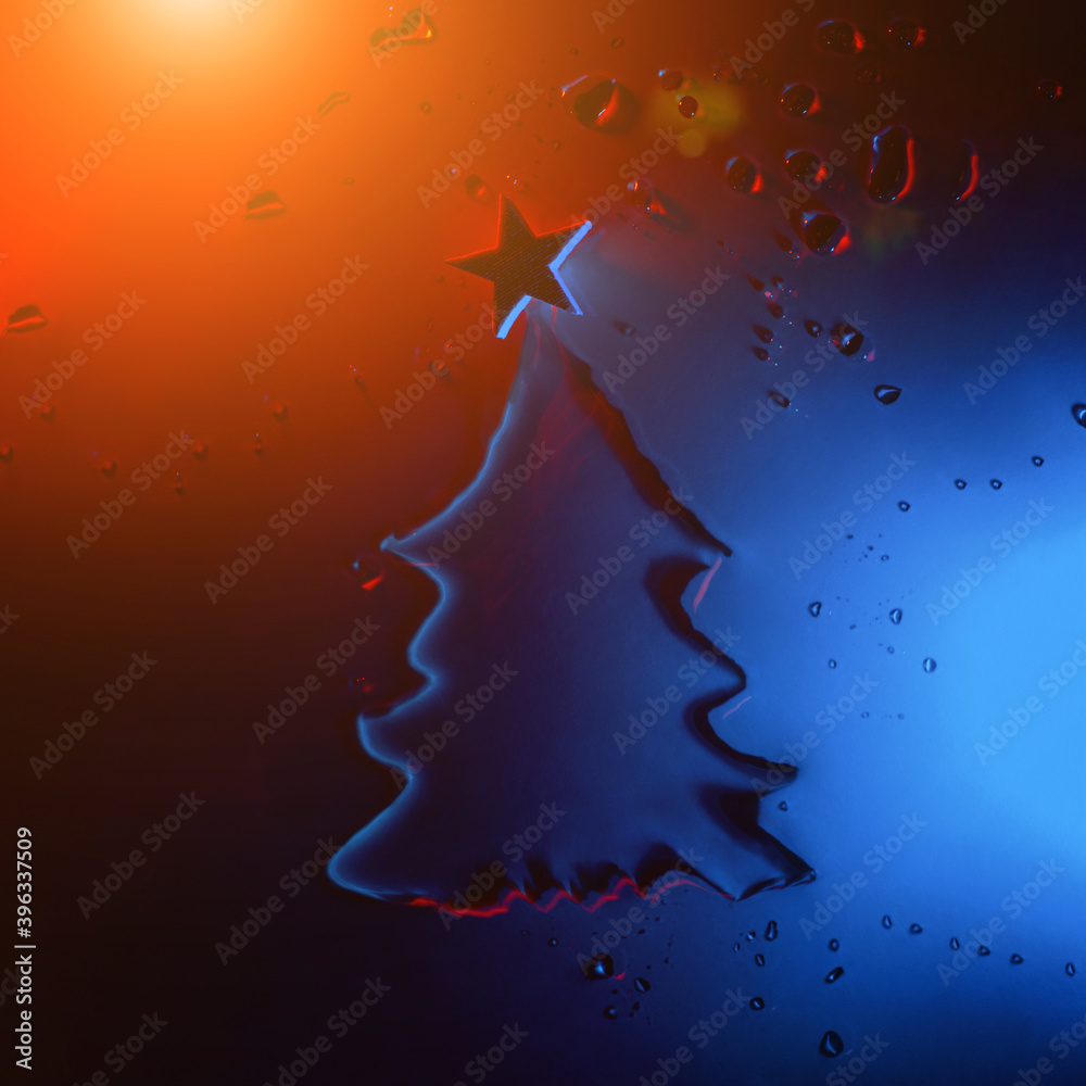 New year and christmas tree made of water with star illuminated by neon, festive concept.