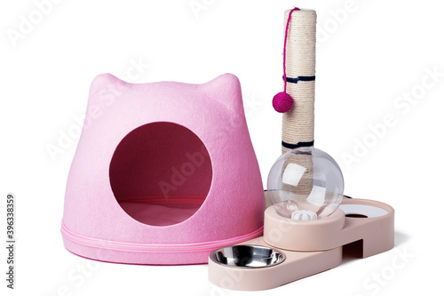 Pet acceesories set for cats: house, scratching post and bowl photo