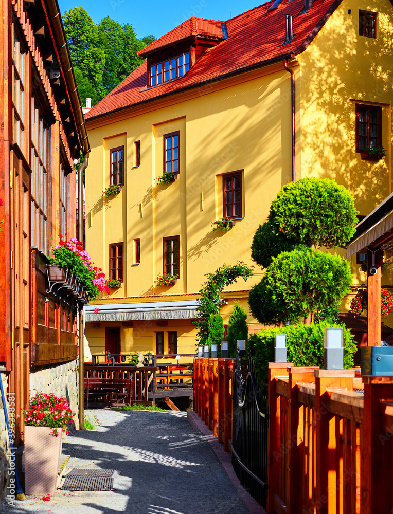 Cesky Krumlov. Czech Republic. Antique house. Picturesque landscape old town in summer sunny day. Authentic buildings with red tile at roof.