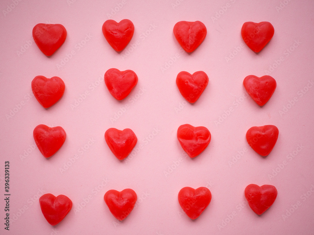 Brightly coloured red gums hearts as valentine present with pink background