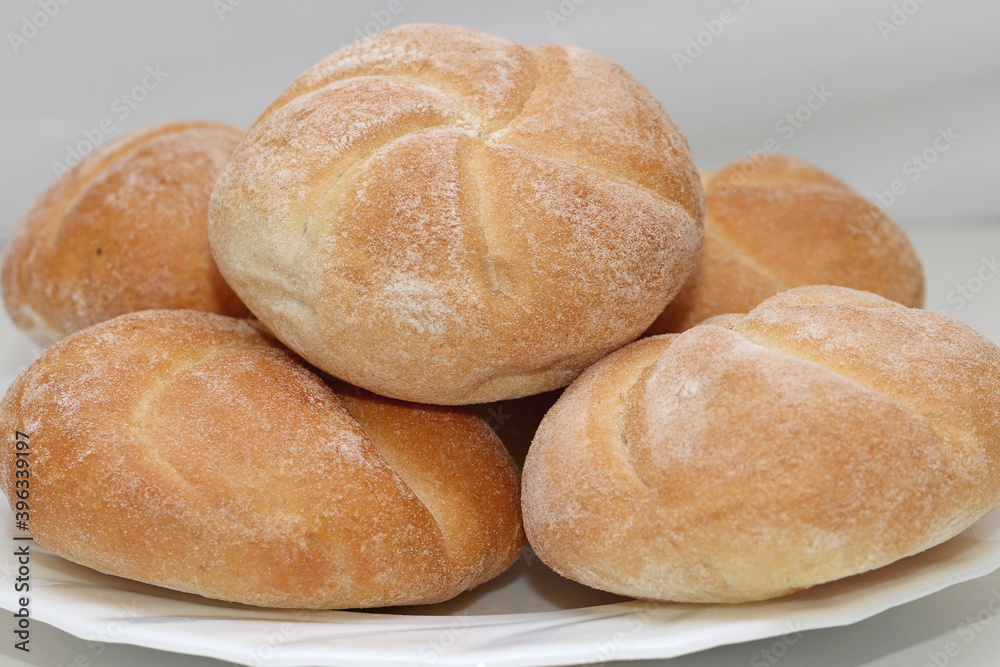 Plate of white flour round buns