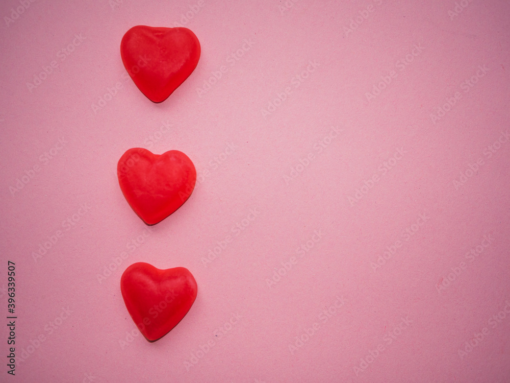 Gummy hearts with pink background. Valentine concept. Copy space