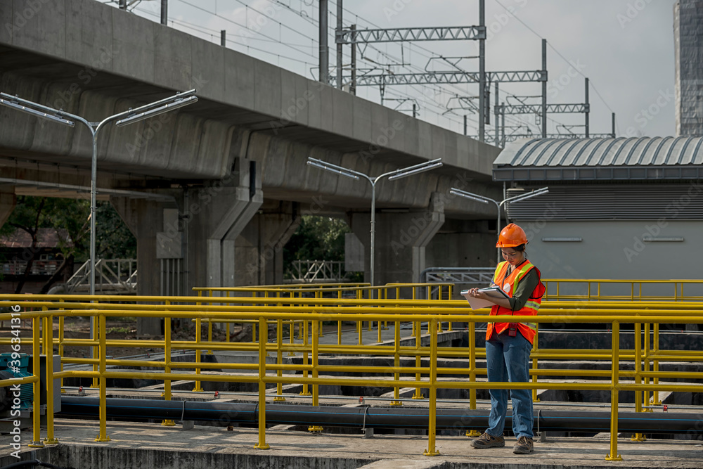 construction workers on construction site. Mechanic inspector engineer check panel broad in factory. women work on construction site. construction workers on construction site. Mechanic inspector engineer check panel broad in factory. women work on construction site.