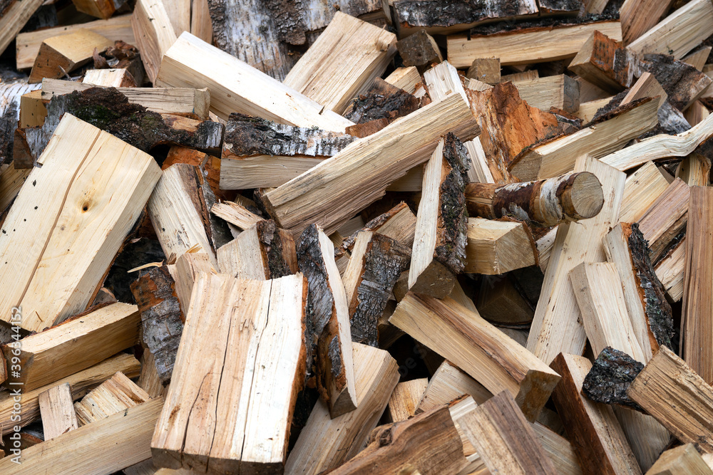Pile of just chopped birch firewood outdoors Pile of just chopped birch firewood outdoors