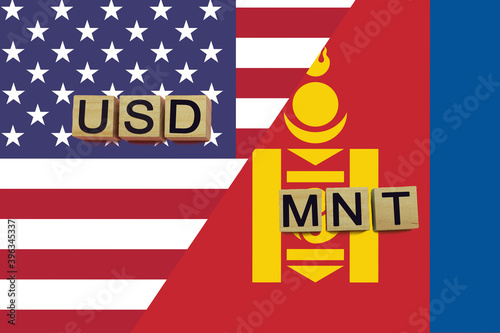 USA and Mongolia currencies codes on national flags background photo