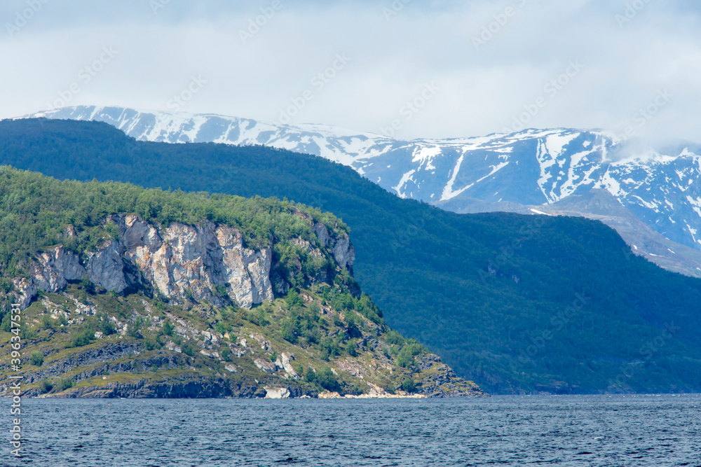 Different layers of mountains at the coast of Norway, Europe Different layers of mountains at the coast of Norway, Europe