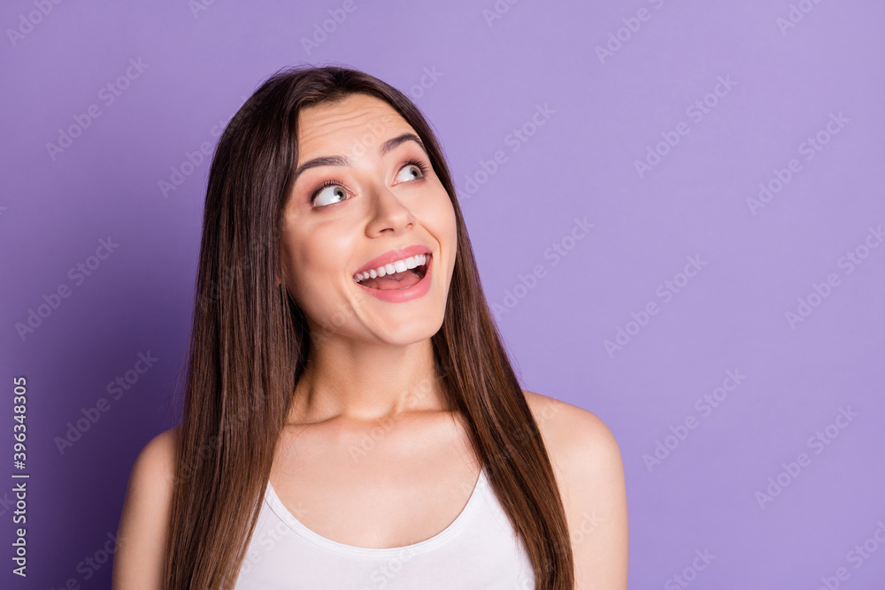 Photo of adorable lovely young lady dressed casual white clothes looking empty space isolated purple color background Photo of adorable lovely young lady dressed casual white clothes looking empty space isolated purple color background