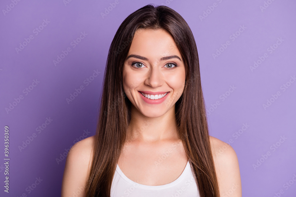 Photo portrait of smiling girl isolated on vivid violet colored background Photo portrait of smiling girl isolated on vivid violet colored background