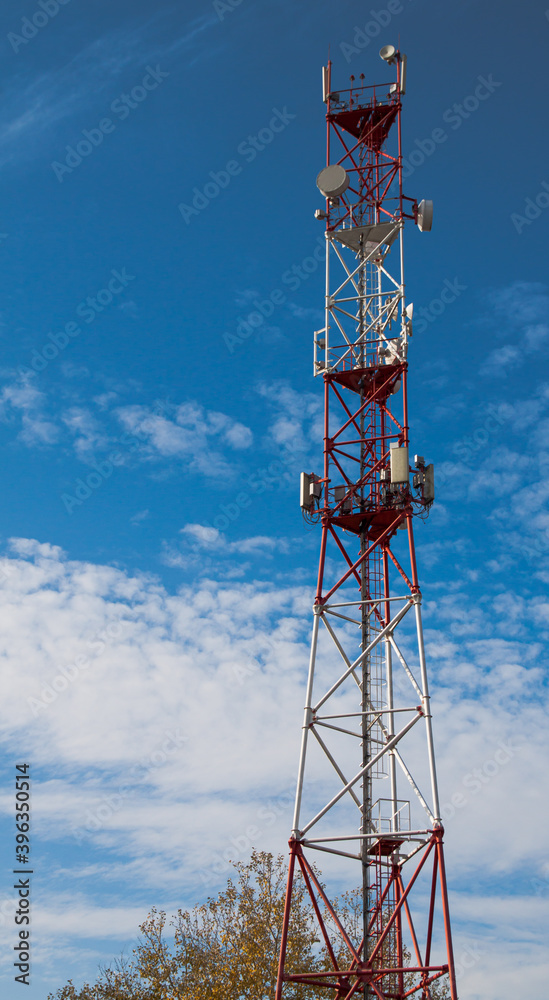 A cell phone tower 4G 5G. Internet connection with a blue sky on the background A cell phone tower 4G 5G. Internet connection with a blue sky on the background