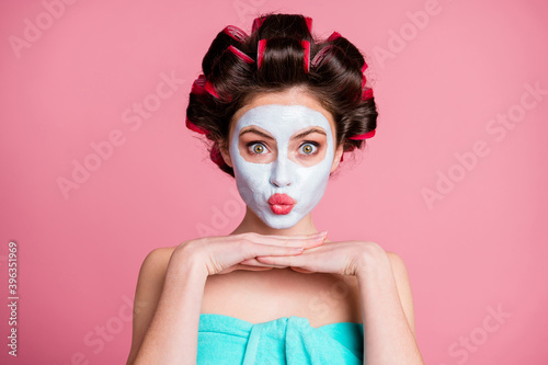 Close-up portrait of pretty funky childish housewife wearing natural organic mask lifting pout lips isolated over pink color background