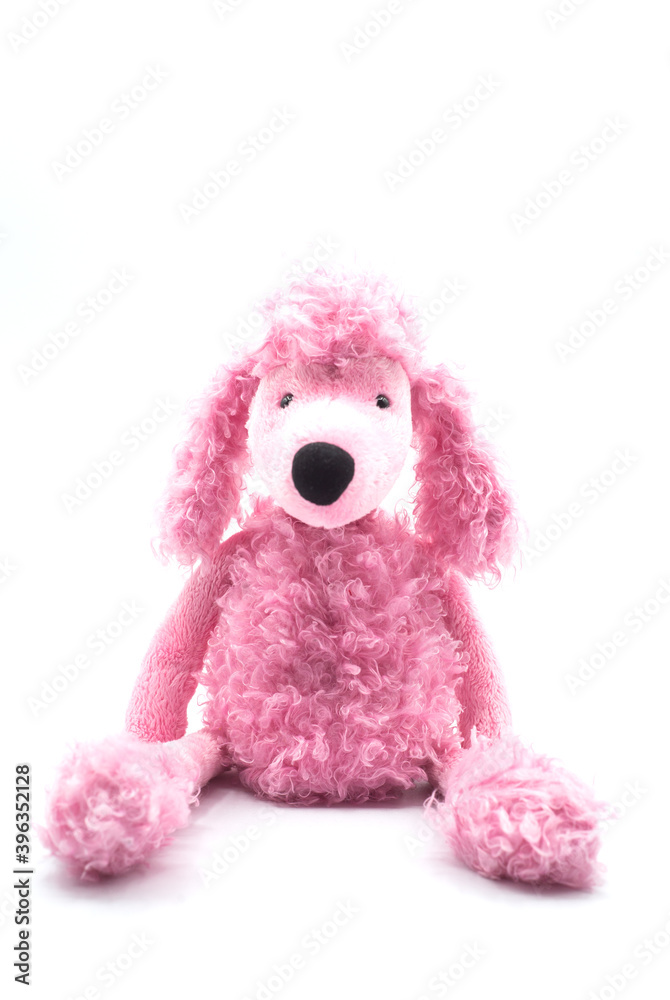 Front view of pink poodle plush sitting on white background Front view of pink poodle plush sitting on white background