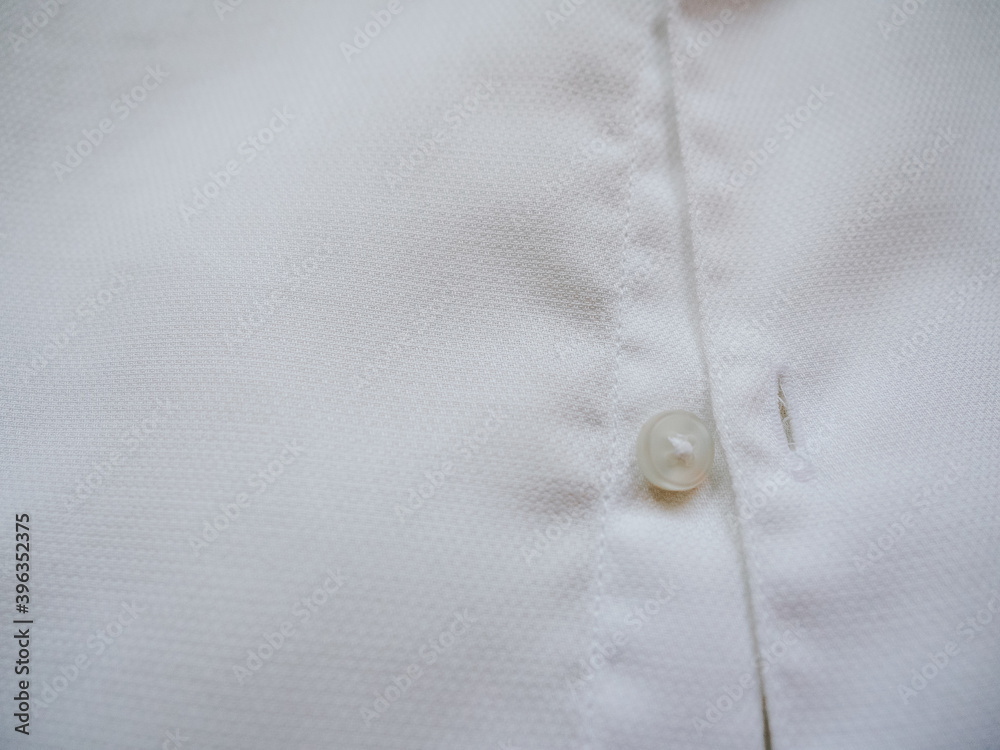 Close-up of cotton t-shirt, fabric texture background. Fashion and textile concept Close-up of cotton t-shirt, fabric texture background. Fashion and textile concept