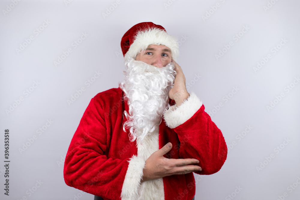 Man dressed as Santa Claus standing over isolated white background thinking looking tired and bored with crossed arms Man dressed as Santa Claus standing over isolated white background thinking looking tired and bored with crossed arms