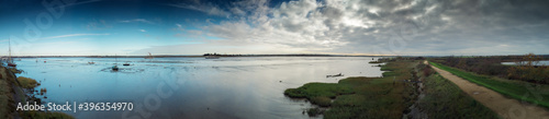 panoramic landscape image of mudflat in essex england