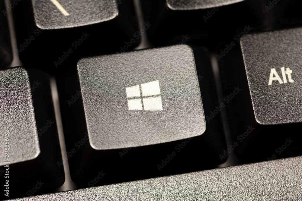 Microsoft Windows 10 operating system logo key on a black desktop computer  keyboard seen from up close. PC OS button macro, extreme closeup, simple  top view Stock-foto | Adobe Stock