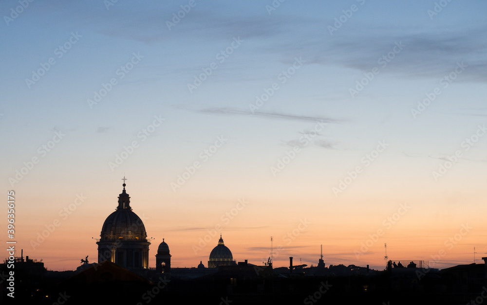 Sunset in Rome. Beautiful blue and pink sky with the silhouette of the cathedral