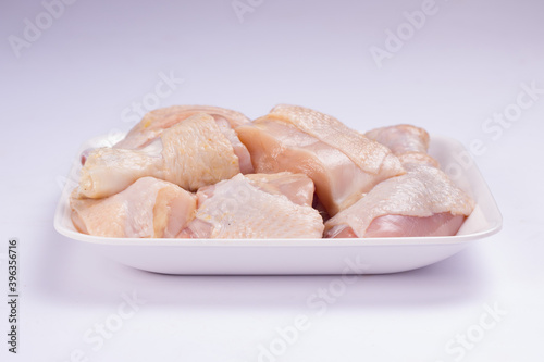 Raw chicken tender curry cut with skin