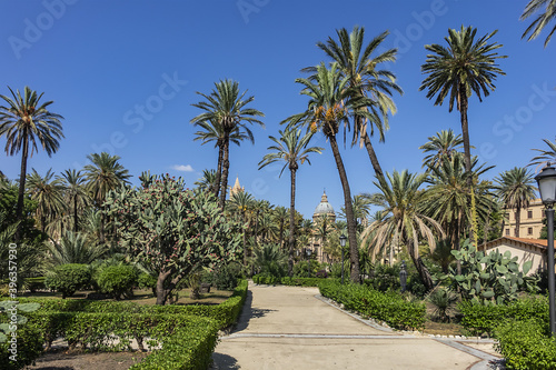 Park Villa near Cathedral of Palermo - 30,000 m2 Public Park founded in second half of XIX century. Park Villa characteristic are lush palm trees. Palermo, Sicily, Italy. © dbrnjhrj