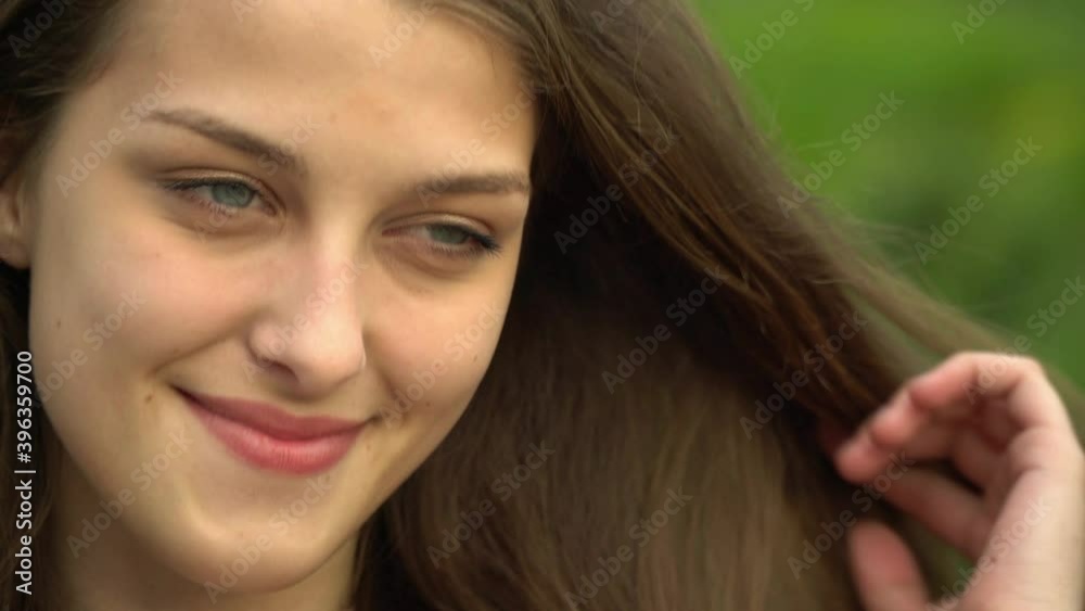 Beautiful girl with a smile on the background of the city Beautiful girl with a smile on the background of the city