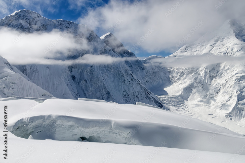 Glacier crack on the background of Tengri Tau Range. Central Tian Shan, Kazakhstan - Kyrgyzstan - China. Glacier crack on the background of Tengri Tau Range. Central Tian Shan, Kazakhstan - Kyrgyzstan - China.