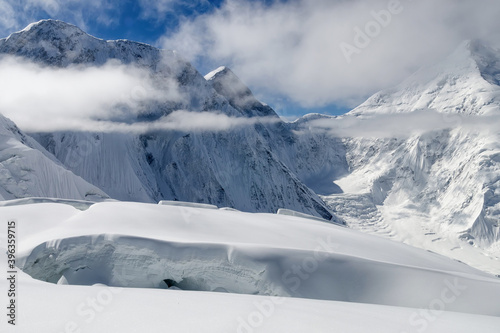 Glacier crack on the background of Tengri Tau Range. Central Tian Shan, Kazakhstan - Kyrgyzstan - China.
