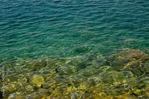 The rocky background of the Adriatic sea throught emerald water © katspi