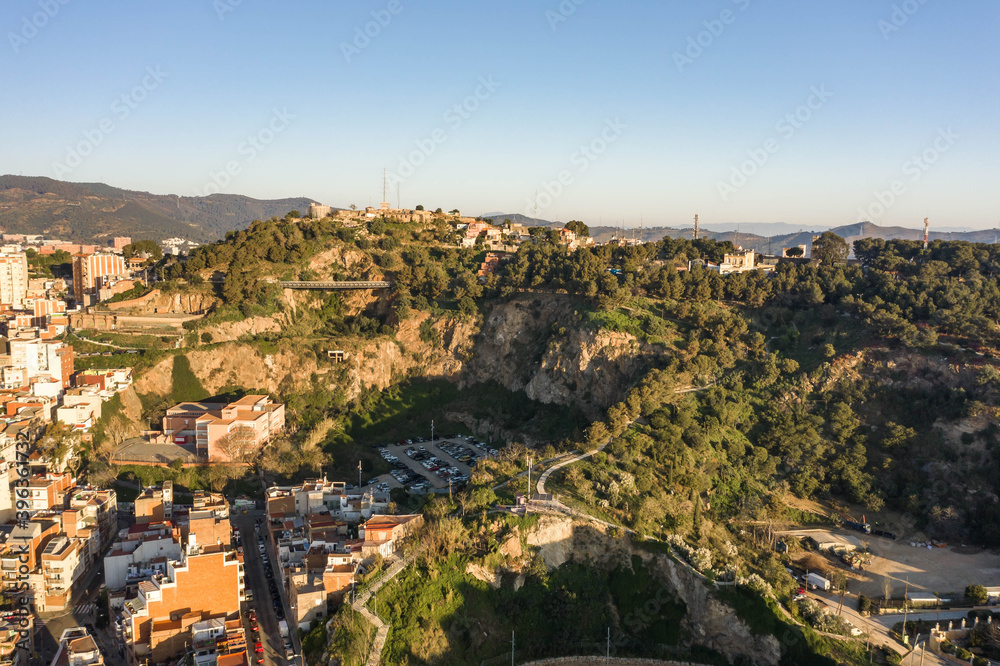 Aerial drone shot of MUHBA Turo de la Rovira hill in Barcelona in morning