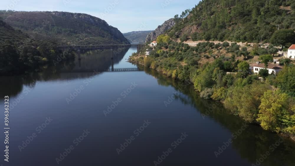 Aerial drone shot towards to a bridge on a lake Aerial drone shot towards to a bridge on a lake