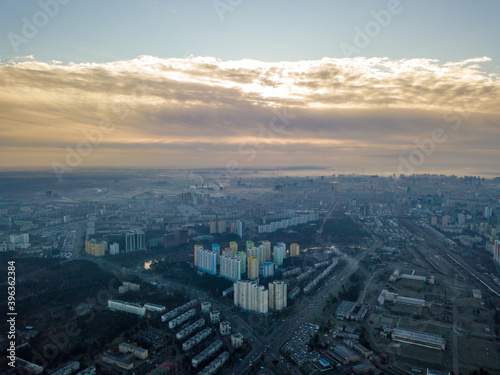 Aerial drone flight over Kiev, haze over the city. Autumn morning.