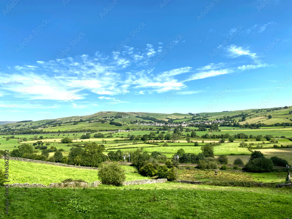 Landscape view, across the Airedale Valley, with railway line, villages, and hills, in the far distance in, Skipton, Yorkshire, UK