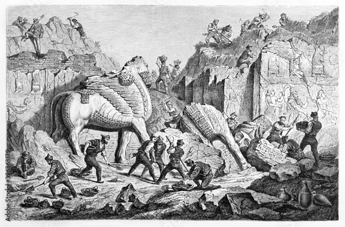 archaeological excavation with several chaldean workers finding old Lamassu in Khorsabad. Ancient grey tone etching style art by Regis, Le Tour du Monde, 1861 photo