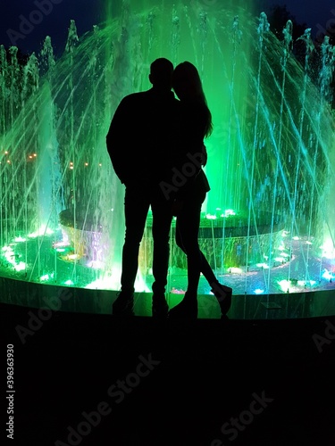 silhouette of a person in a fountain