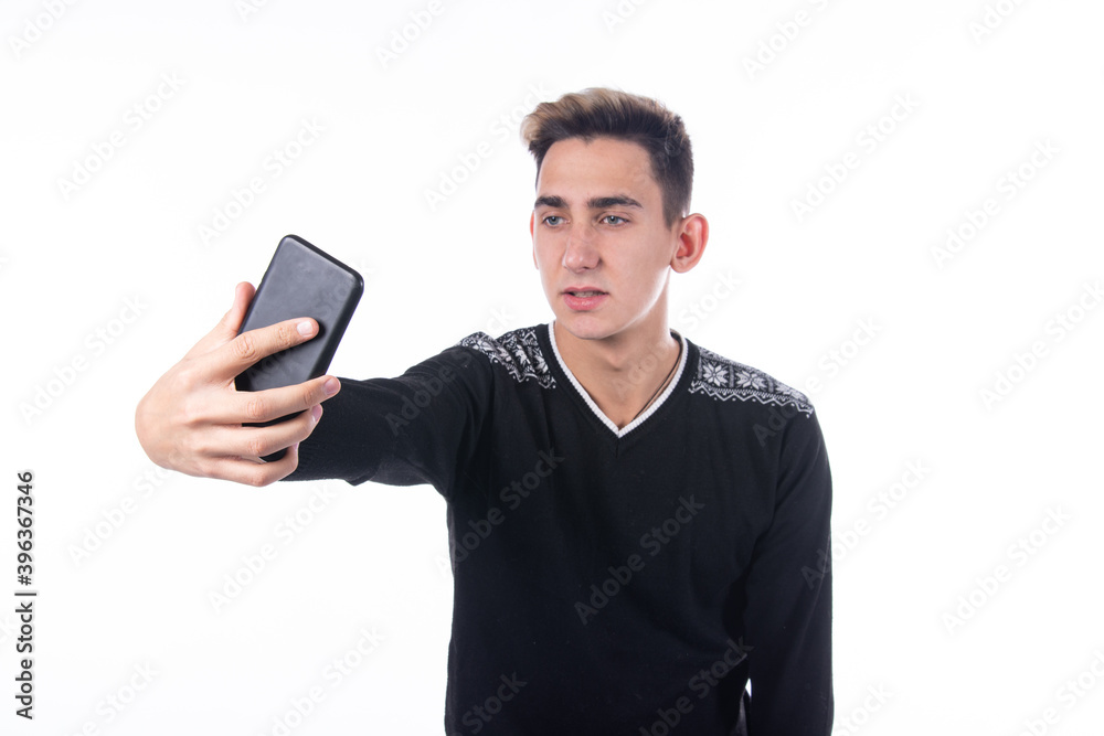 Nice guy takes a selfie. Typing sms and talking on the phone. Nice guy takes a selfie. Typing sms and talking on the phone.