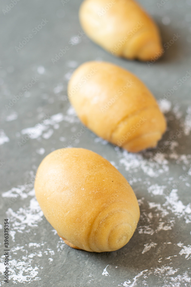 Oil bread buns homemade on a grey background Oil bread buns homemade on a grey background
