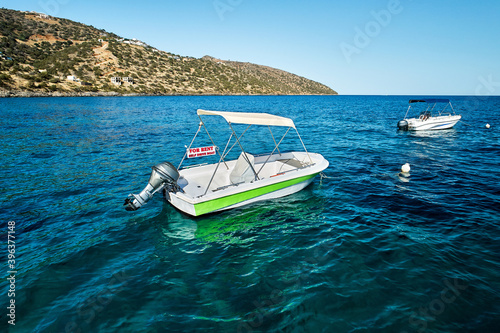 Schilderij op canvas Sea landscape with the self drive motor boat for rent in white and green color o