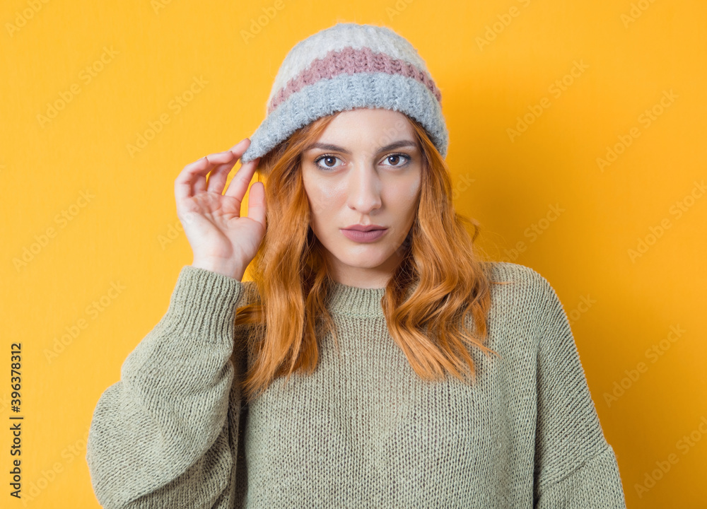 Attractive young woman, isolated on yellow background. Beautiful girl. Front view.