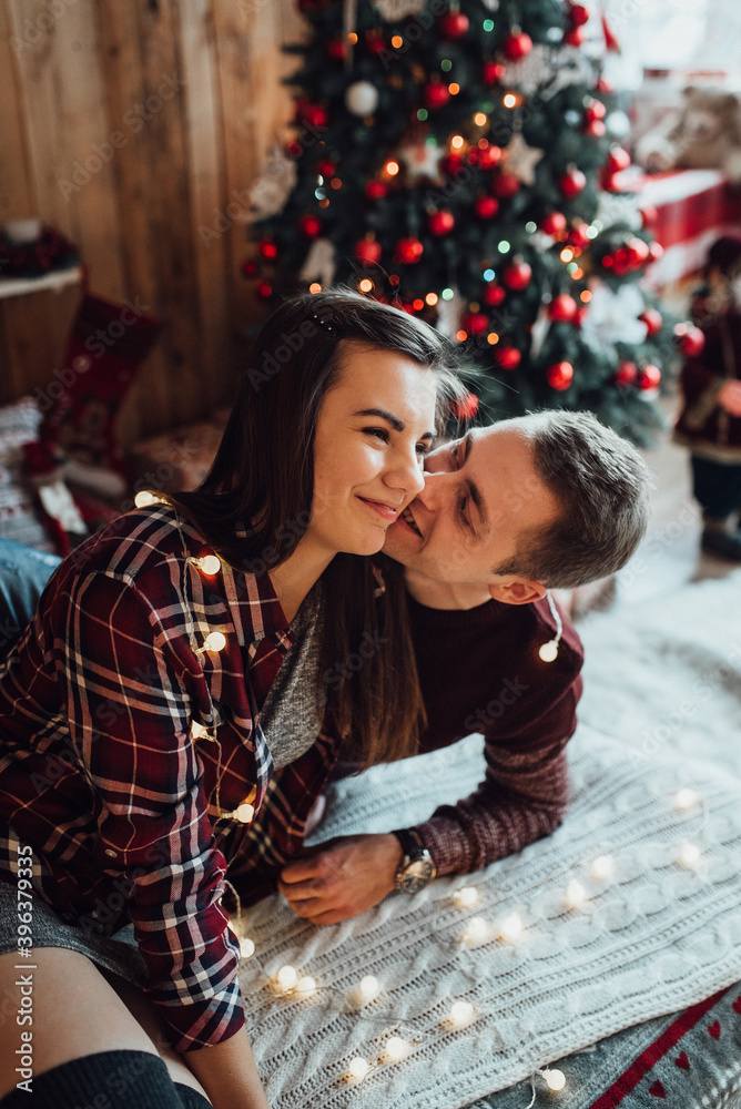 a guy and a girl celebrate the new year together. and give each other gifts a guy and a girl celebrate the new year together. and give each other gifts
