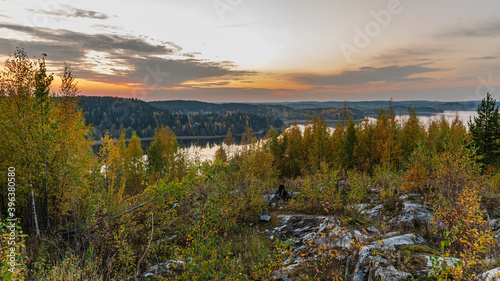 sunset over the like shore in autumn